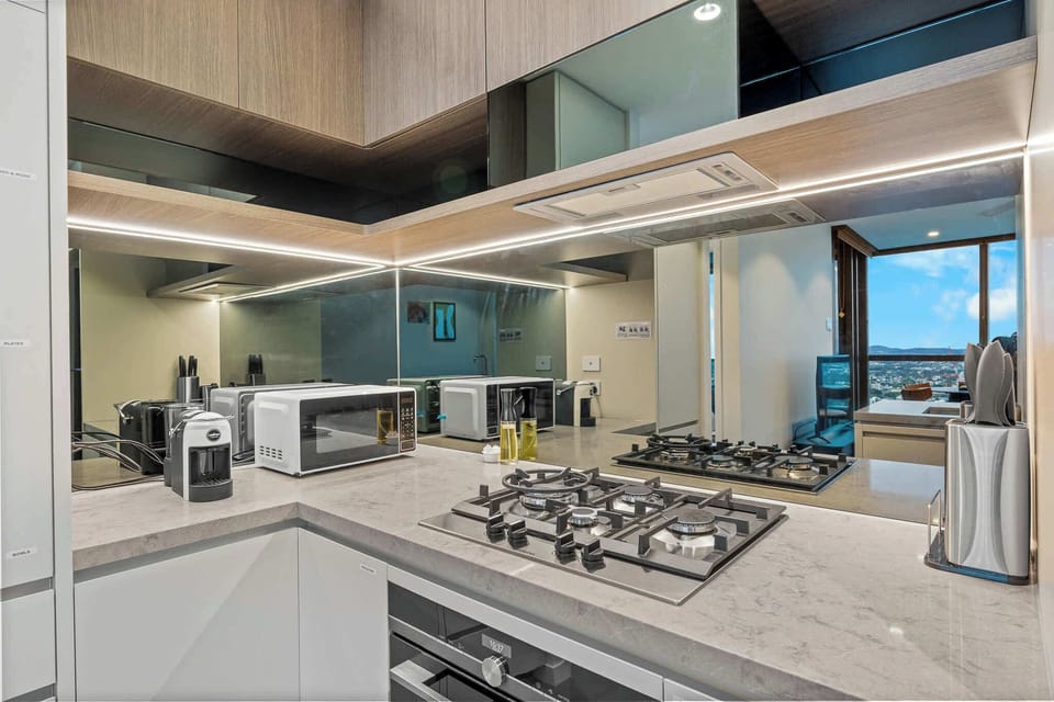Fully equipped kitchen featuring gas cooktop, oven, and everything needed to cook at home.