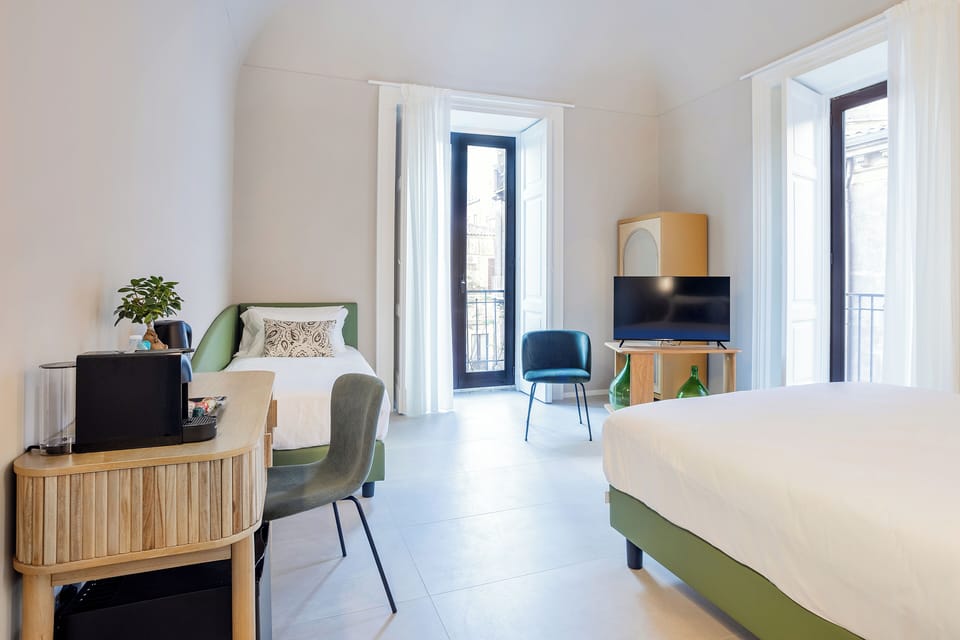 Deluxe Triple Room, City View | In-room safe, laptop workspace, blackout drapes, soundproofing