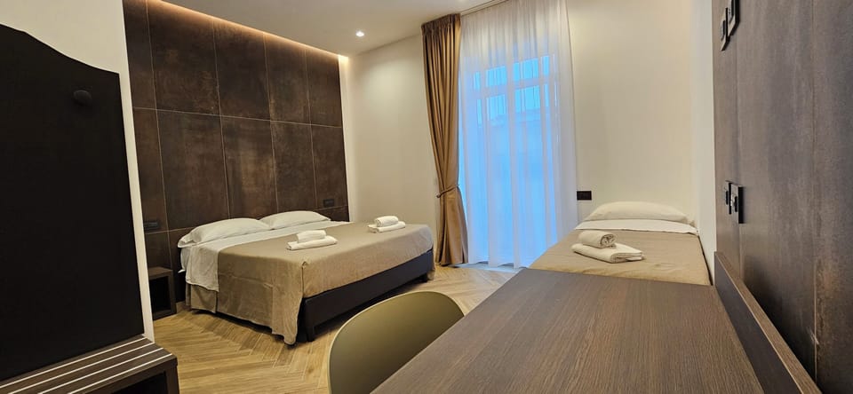 Deluxe Quadruple Room | Hypo-allergenic bedding, pillowtop beds, desk, laptop workspace