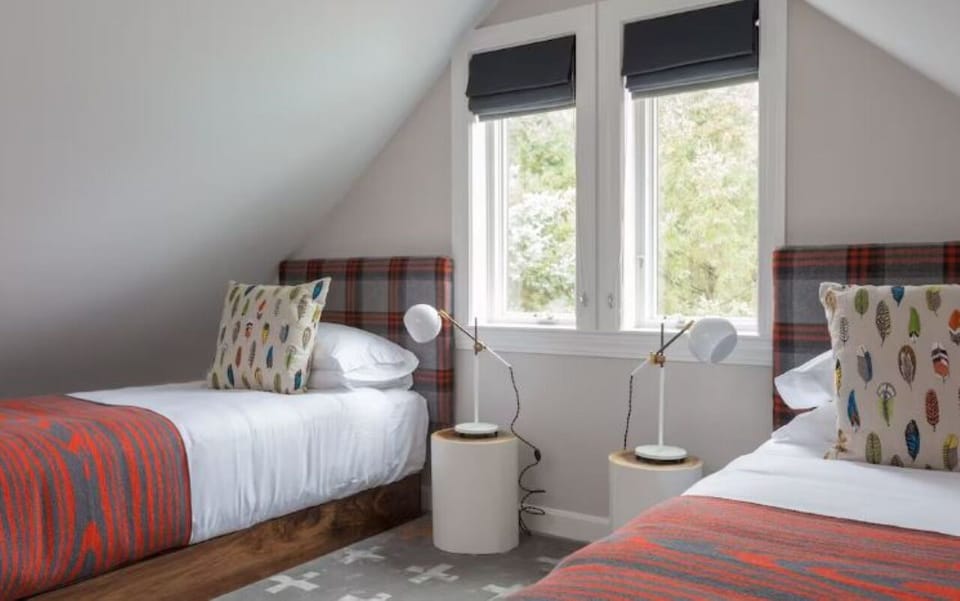 Wake to soft daylight in bright twin beds for friends.
