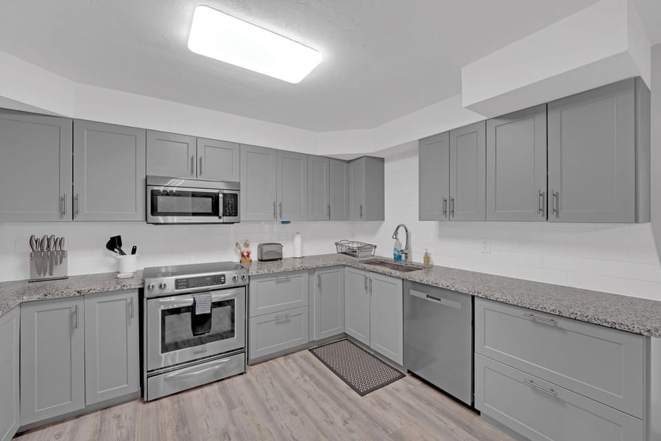 Nice appliances and cabinets in this bright kitchen