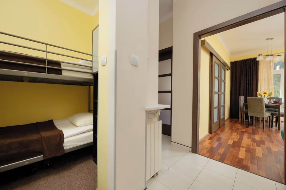 Another view of the same sleeping alcove, this time from a slightly different angle, clearly showing the bottom bunk and its cozy setup.