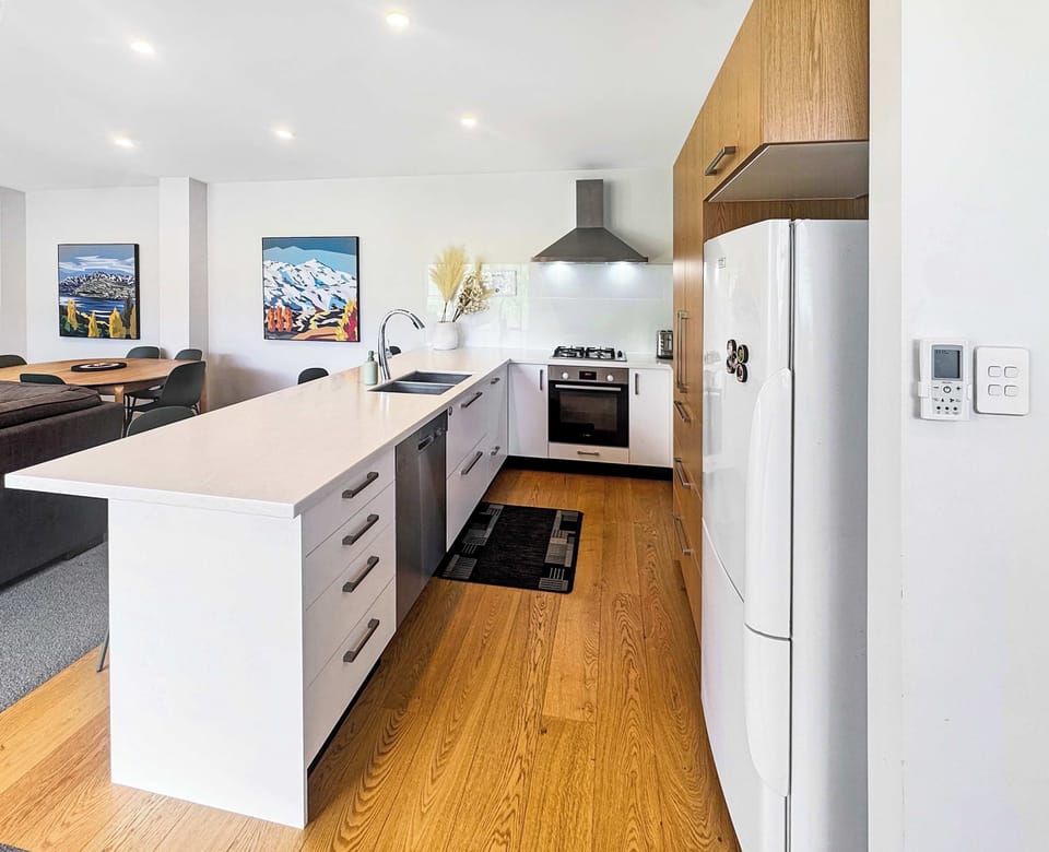 Fully equipped modern kitchen with quality appliances—ideal for home-cooked meals.