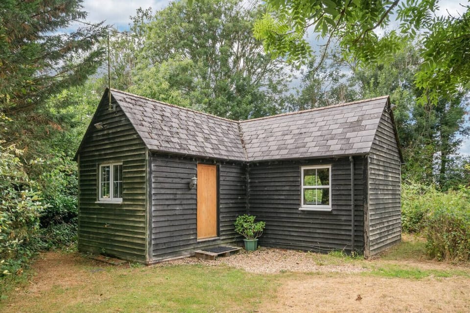 The Hideaway’s rustic facade and natural setting