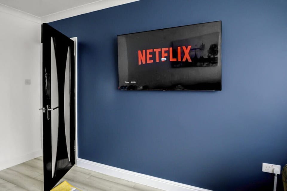 Wall-mounted TV with Netflix for cosy nights in