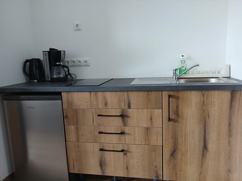 Fridge, stovetop, electric kettle, toaster