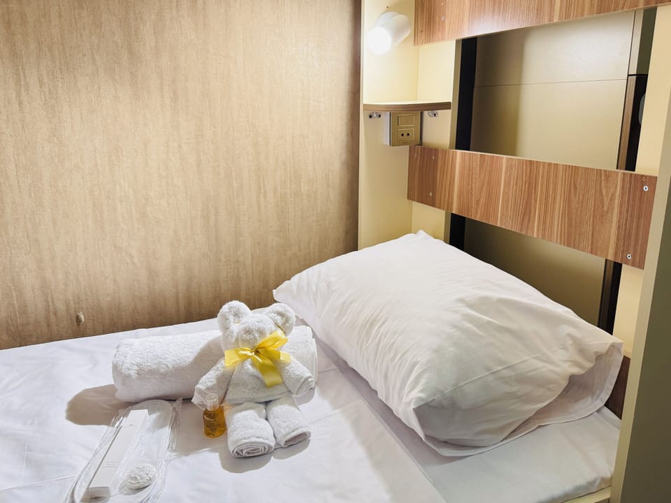 Comfort Shared Dormitory | Premium bedding, desk, laptop workspace, blackout drapes