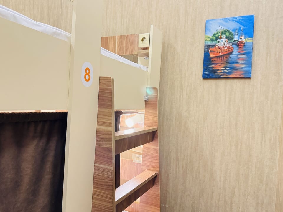 Comfort Shared Dormitory | Premium bedding, desk, laptop workspace, blackout drapes