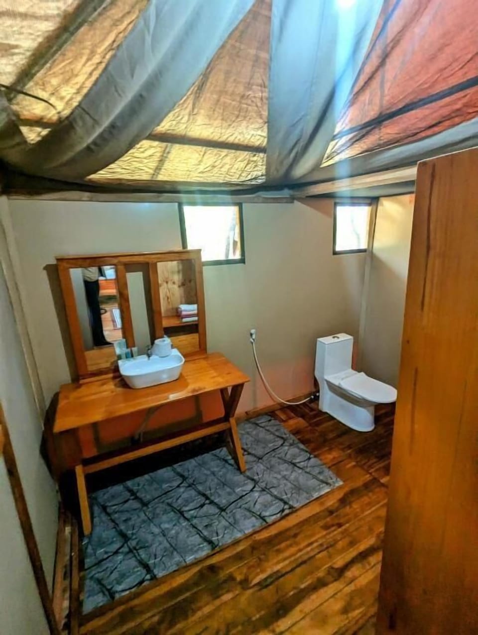Bathtub, hair dryer, slippers, towels