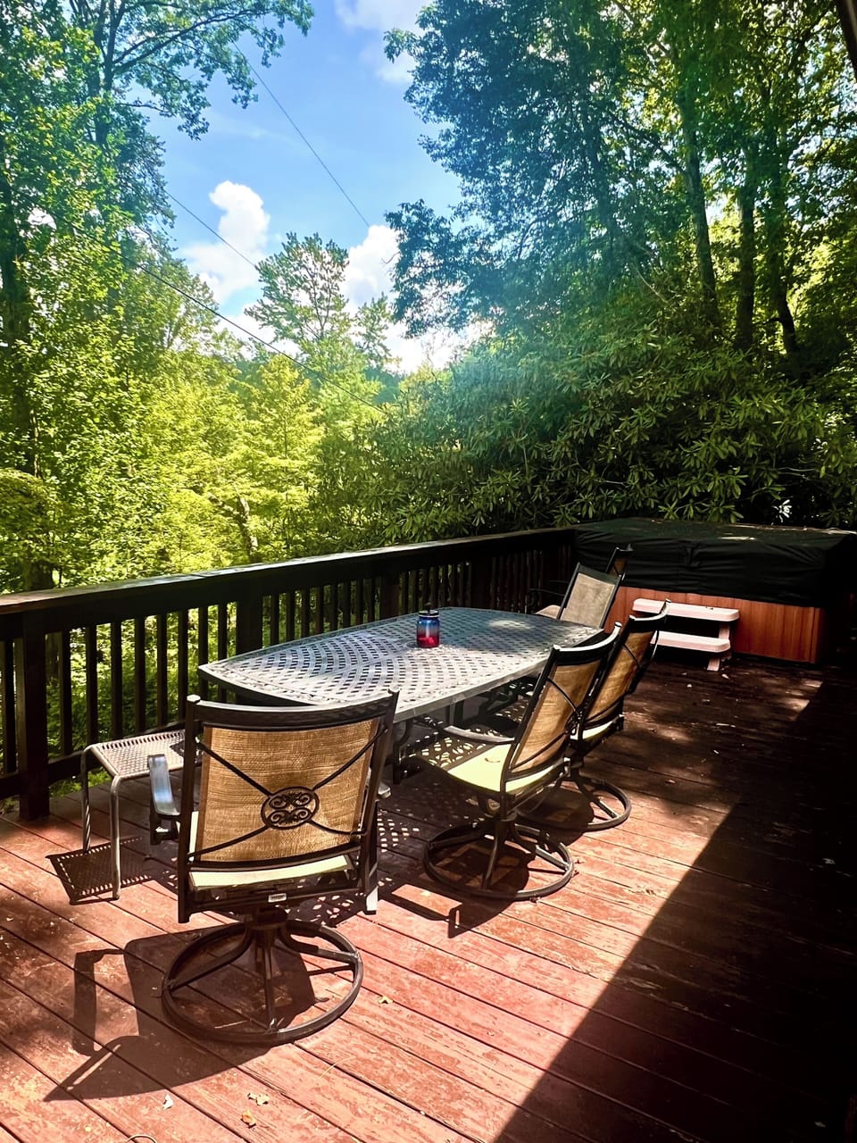 Outdoor dining with lake view. Hot tub