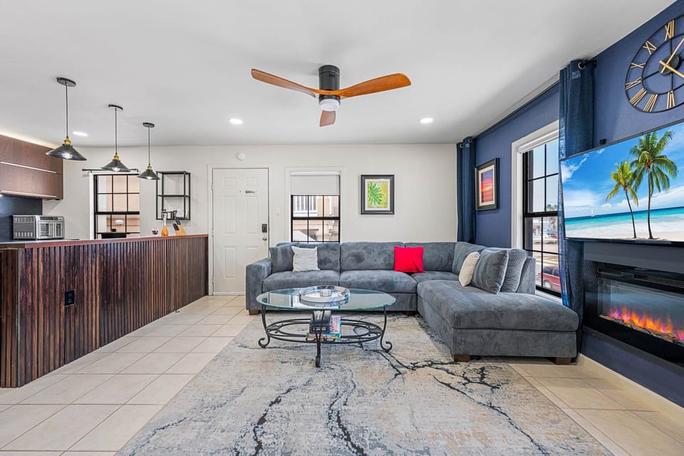 Large sofa, TV can be viewedfrom kitchen.
