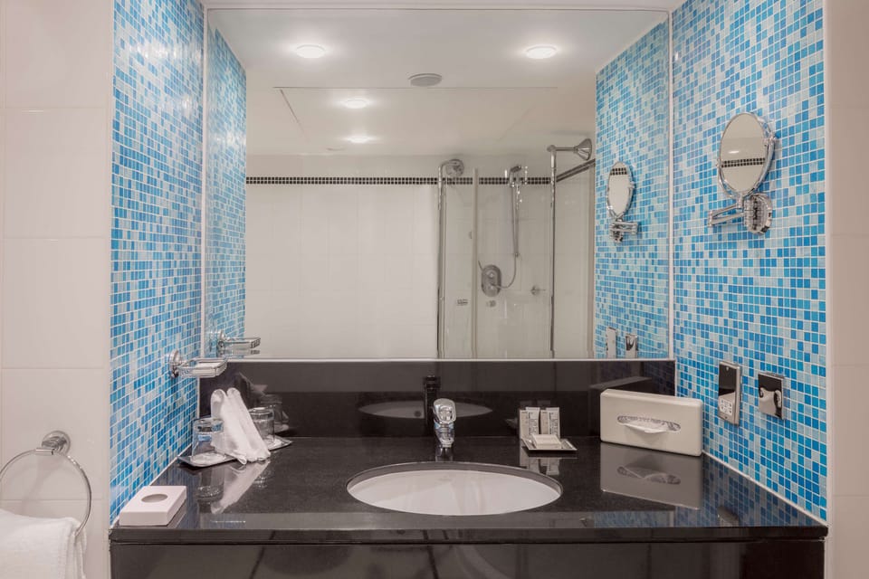 Suite, 1 King Bed, Bathtub | Bathroom | Combined shower/tub, deep soaking tub, free toiletries, hair dryer
