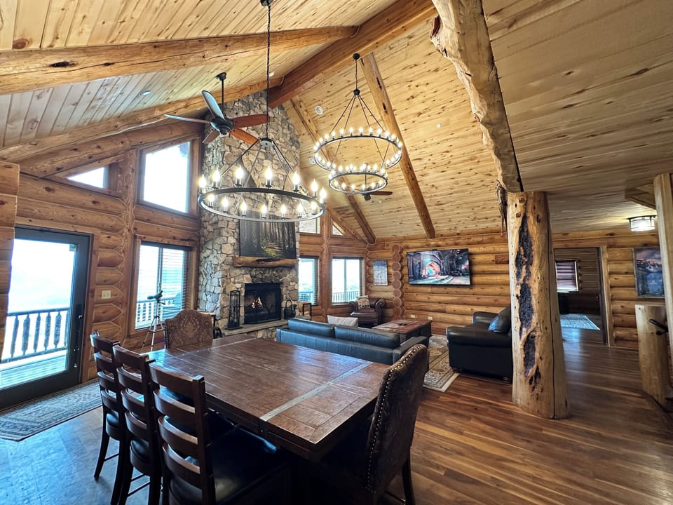 Great Room w/ Wood Fireplace, Kitchen, Dining Table, Living Room, and Loft