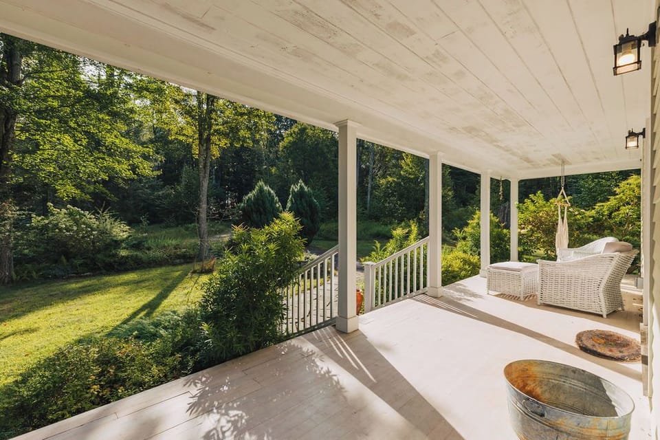 Soak in the morning sun on the expansive wraparound porch.