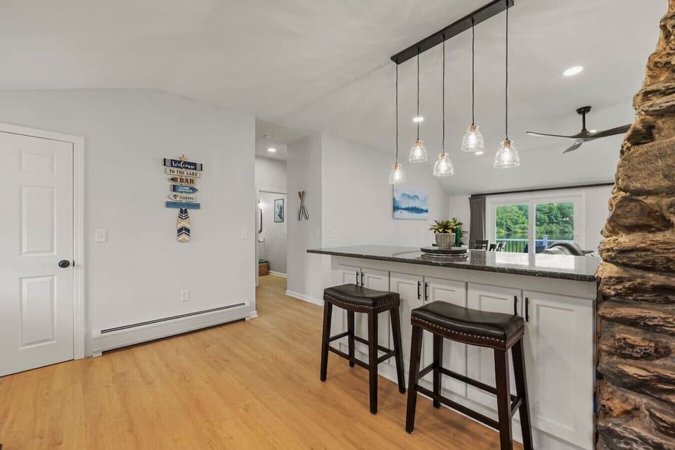 Breakfast bar with stylish pendant lighting and seating for four.