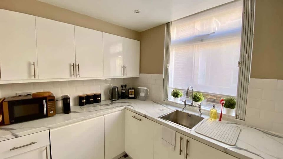 Small but fully equipped kitchen with washer dryer, dishwasher, coffee machine and microwave