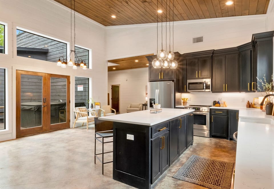 Step into a space where kitchen meets comfort, featuring a large island for gathering and an open floor plan that keeps everyone connected, from cook to couch.