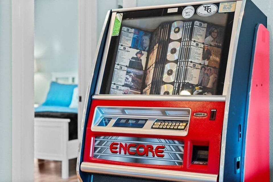 Vintage-style music jukebox arcade machine providing unique indoor entertainment for guests of all ages.