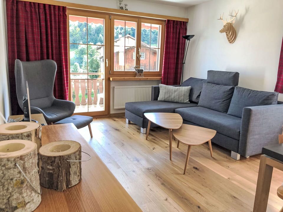 Furniture, Interior Design, Wood, Flooring, Floor, Living Room, Room, Wood Flooring, Table, Couch