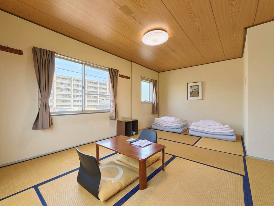 Japanese-style Twin Room, Smoking, Shared Bathroom (for 1 pax) | Down comforters, free WiFi, bed sheets