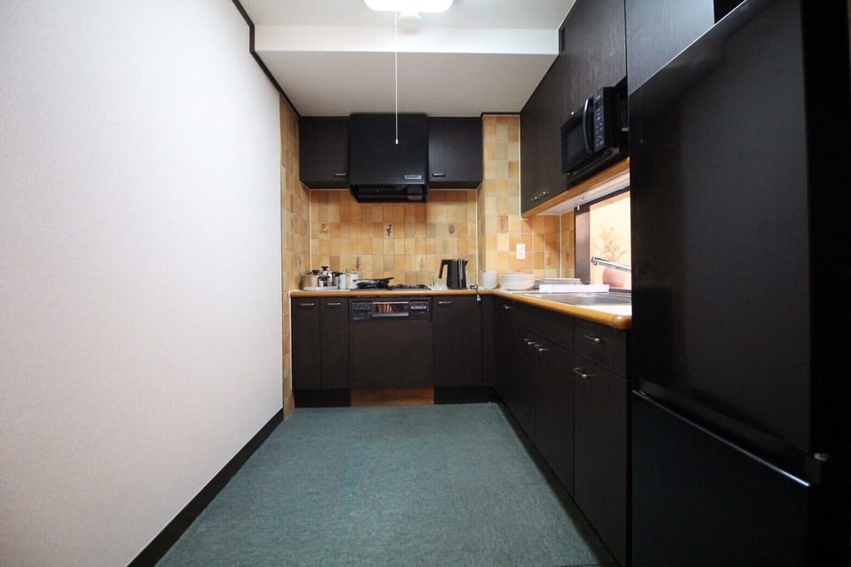 Apartment | Private kitchen | Full-size fridge, microwave, stovetop, cookware/dishes/utensils
