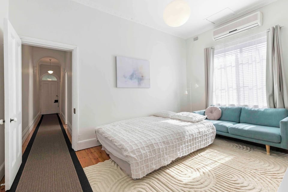 Living room with the sofabed made up. For privacy, Hallway doors can be closed off on both sides to this room, however please note it is the only way through to the kitchen and bathroom.