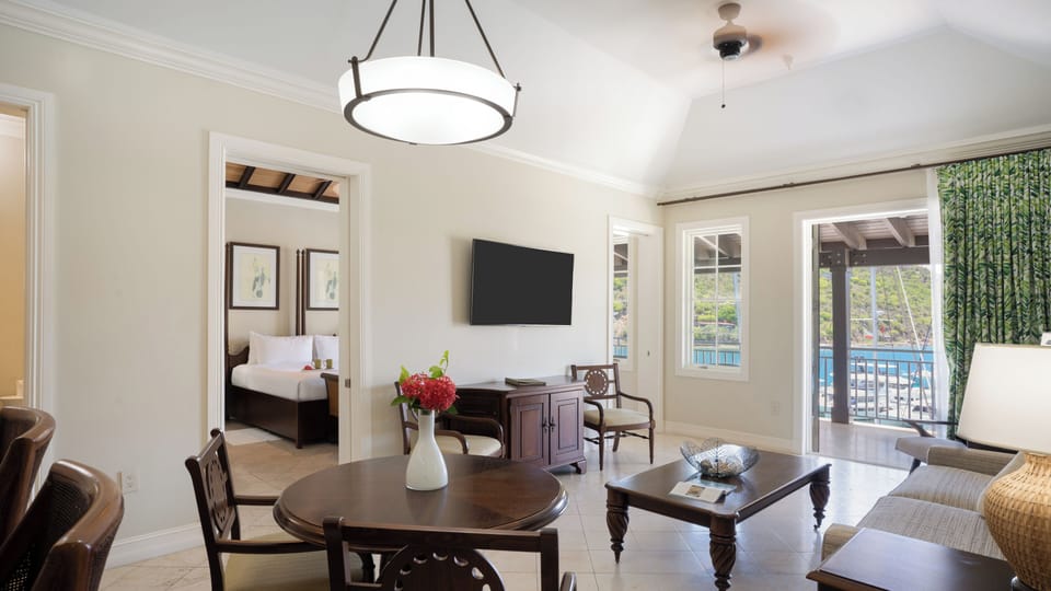Relax together in the bright sitting area opening to the balcony.