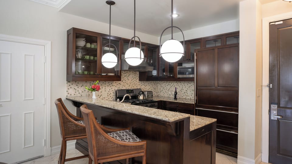 Cook with ease in a sleek granite-topped chef’s kitchen.