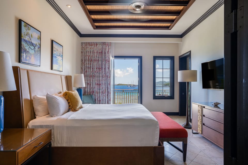 Lounge in a stylish bedroom with expansive sea views.