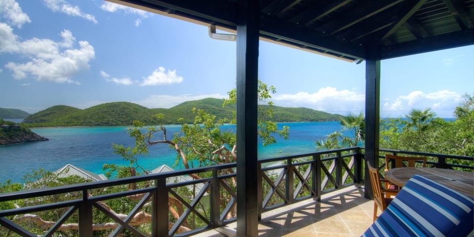 Sip morning coffee as endless blues stretch beyond the railing.
