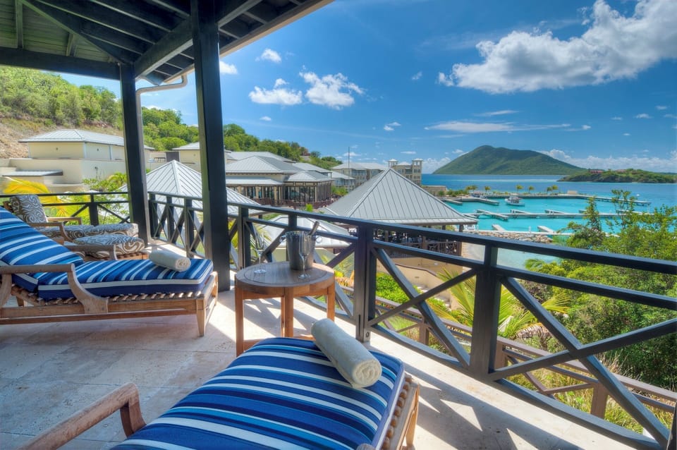 Lounge with a cool drink overlooking the sparkling marina.