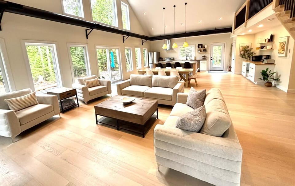 Gather, relax, and connect – the open-concept great room features cozy seating, soaring ceilings, and an airy layout perfect for making memories together.