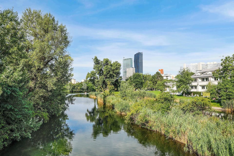 Lush Riverbank Escape — Greenery & Water Views Create a Natural Urban Oasis