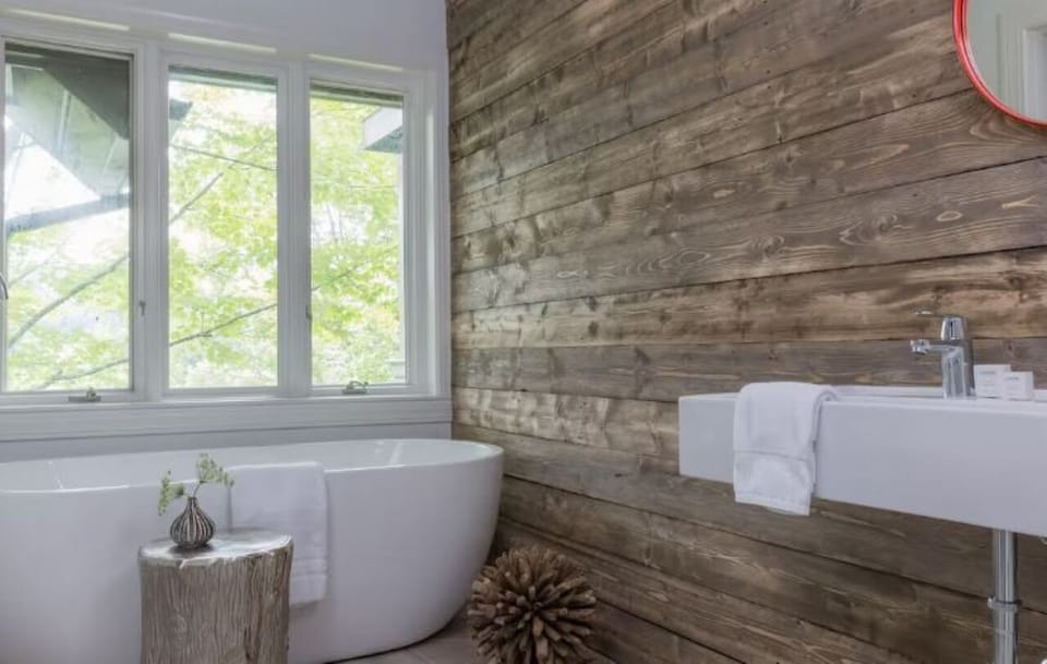 Soak peacefully in the deep tub beside woodland light.