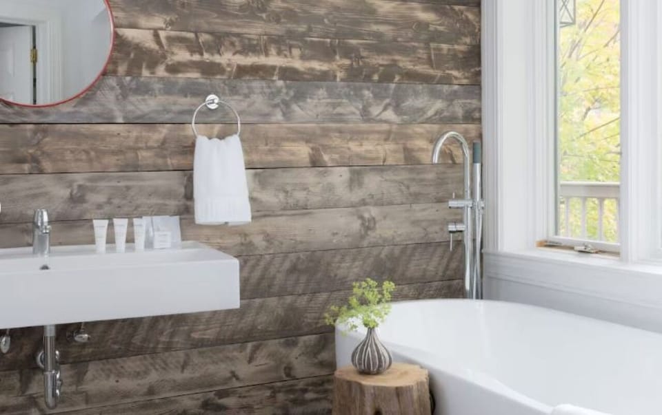 Refresh in a serene bath space with rustic wood accents.