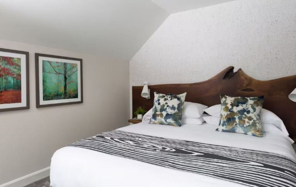 Drift off under vaulted ceilings in a calm, cozy retreat.