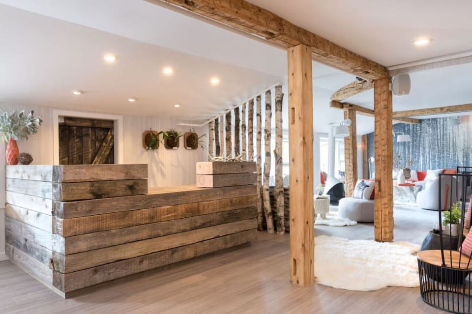 Step into a warm welcome at the rustic-chic reception desk.
