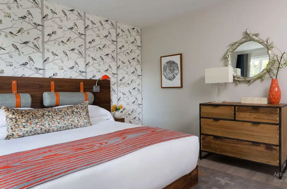 Enjoy extra storage and bright style in this serene bedroom.