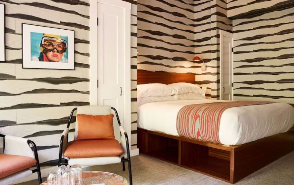 Recharge in a playful, patterned room with roomy king bed.