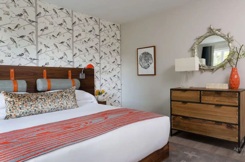 Relax in a chic suite with artful accents and ample storage.