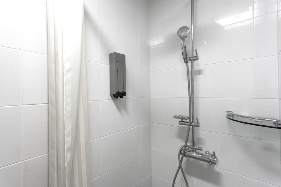 Shower, free toiletries, hair dryer, slippers