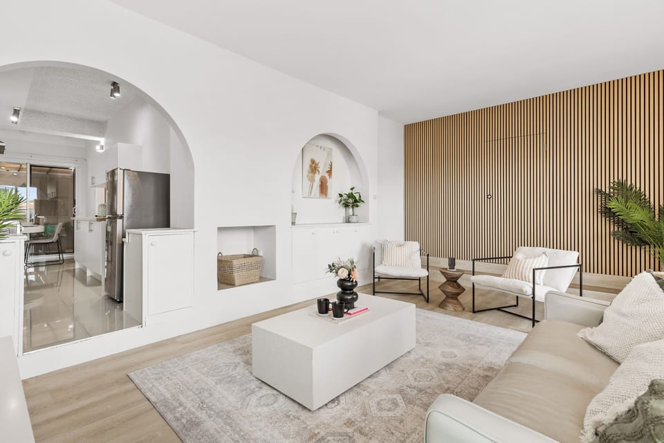 Step into the stylish and bright living area of our Malolos home. Relax on the comfortable sofa or one of the modern armchairs, perfect for unwinding after a day of exploring. 