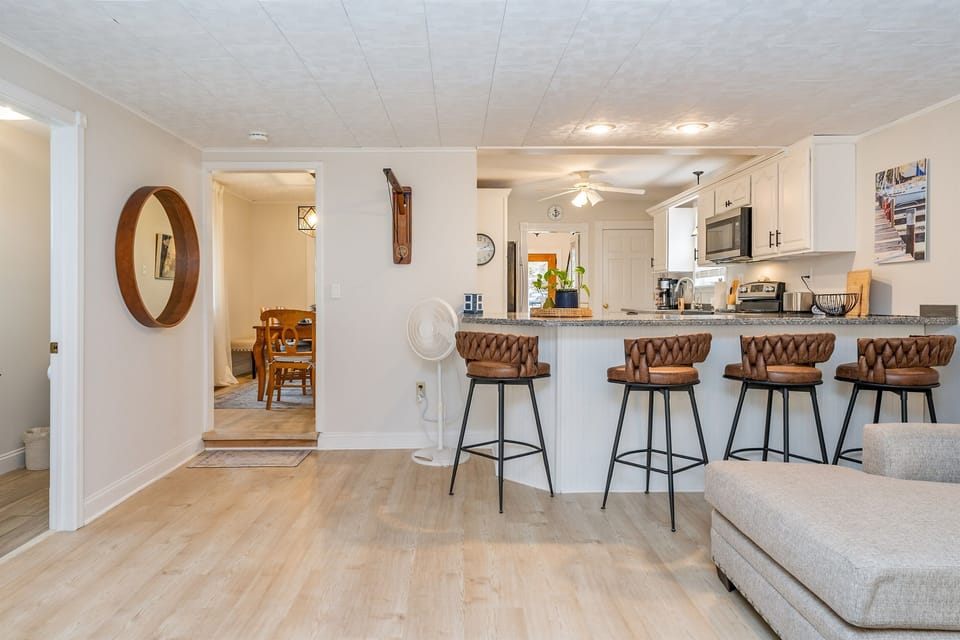 Gather with friends or family at the breakfast bar or adjoining the living room area—this open layout makes meal prep feel like a celebration.