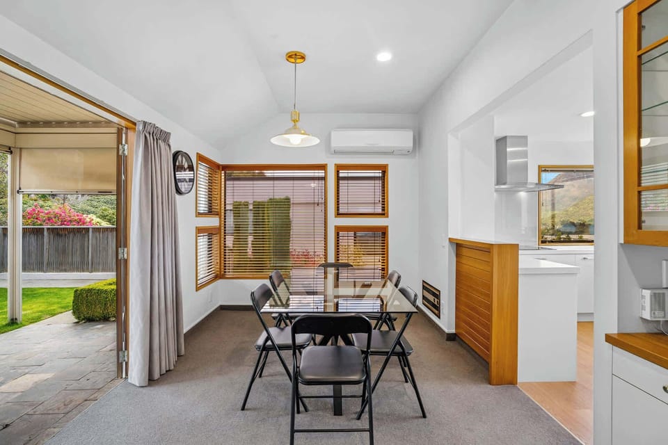 Indoor–outdoor dining – French style doors open to the garden for fresh air and sunshine.