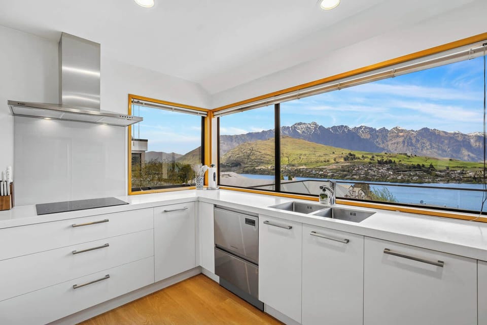 Unforgettable outlook – Cook while overlooking Lake Wakatipu and The Remarkables range.