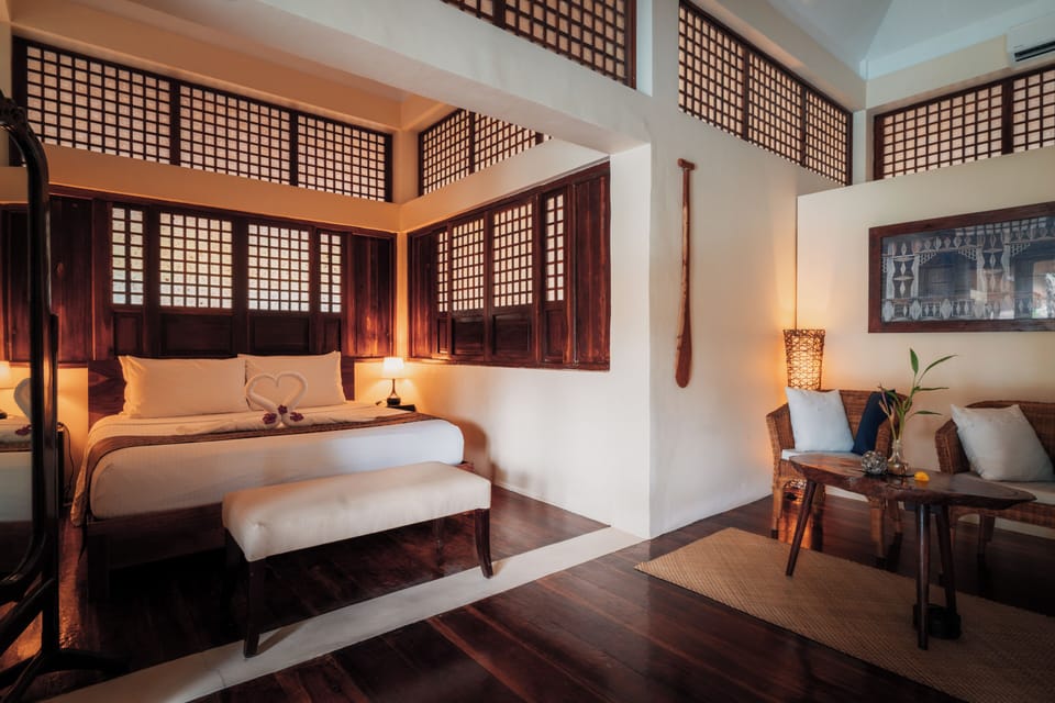 Room (Pool View King) | Minibar, in-room safe, individually decorated, individually furnished