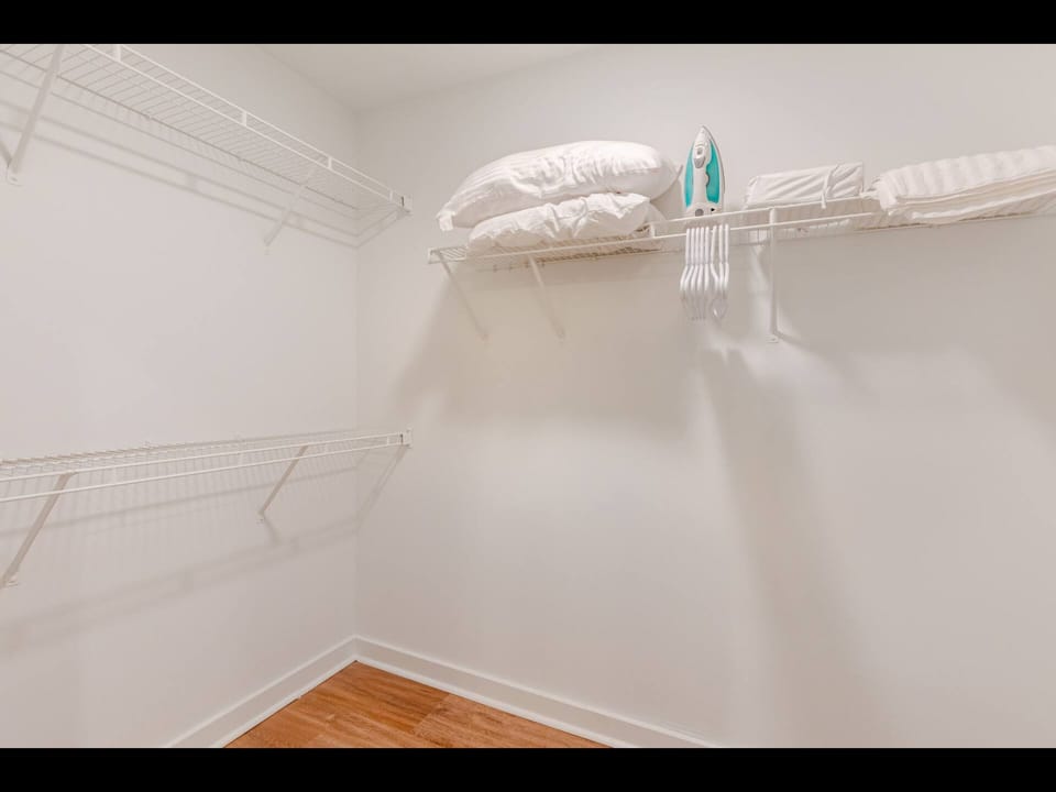 Walk-in closet with fresh linens & plenty of storage