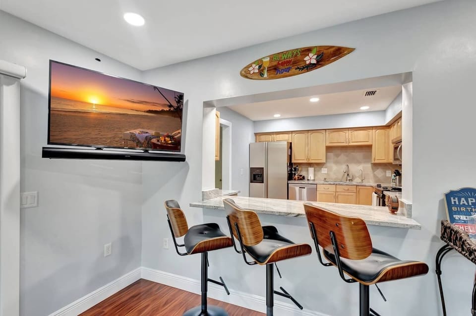 Pull up a chair—our bar seating flows effortlessly into the kitchen.