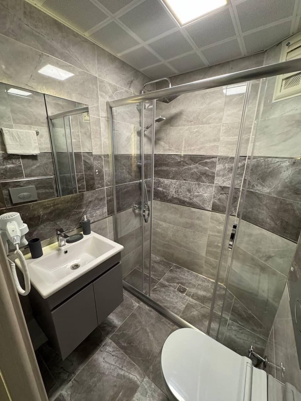 Separate tub and shower, hair dryer, towels, soap