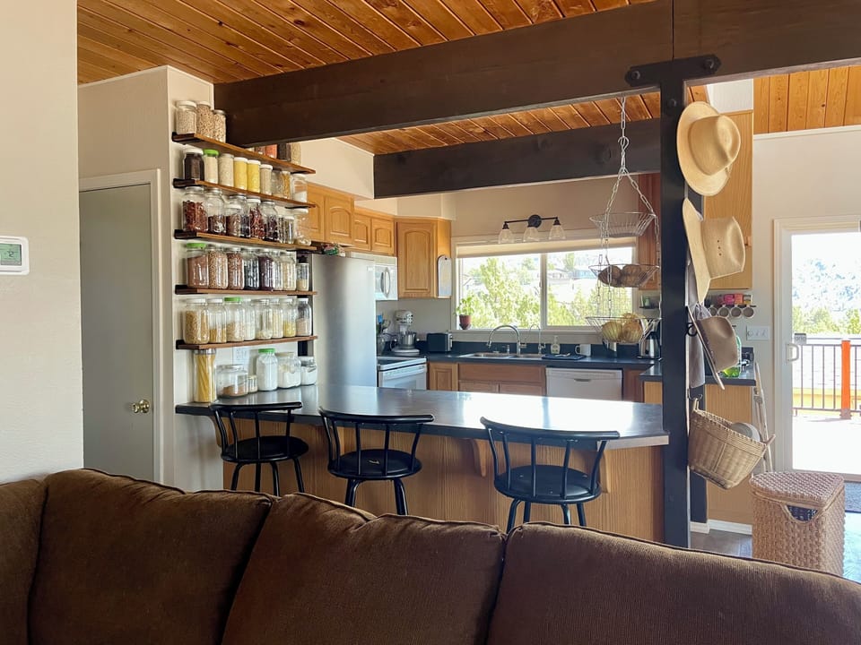 Kitchen with bar stools on peninsula